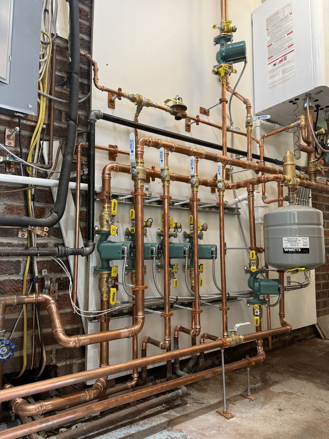 New copper boiler piping with zoned circulator pumps installed by JPM
