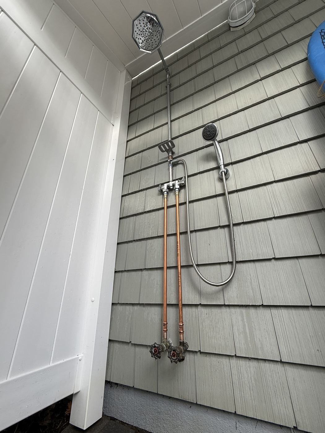 Outdoor shower with exposed copper risers