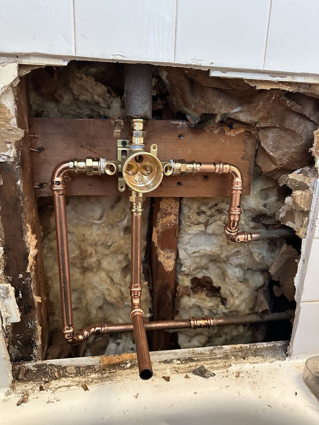New shower valve and copper piping in an open wall
